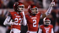 Utah Utes safety Jackson Bennee (23) and cornerback Smith Snowden (2) react to a play against the Arizona State Sun Devils during the third quarter at Rice-Eccles Stadium.