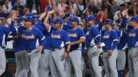 Venezuela coaching staff celebrates after winning the quarterfinal game of the 2026 World Baseball Classic against Japan at loanDepot Park.