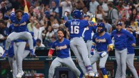 Venezuela right fielder Ronald Acuna Jr. (21), first baseman Willson Contreras (40) and third baseman Maikel Garcia (11) celebrate a three-run home run by left fielder Wilyer Abreu (16) against Japan in the sixth inning during a quarterfinal game of the 2026 World Baseball Classic at loanDepot Park.