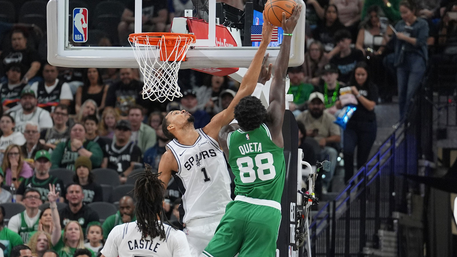 San Antonio Spurs forward Victor Wembanyama (1) blocks a shot against Boston Celtics center Neemias Queta (88) in the first half at Frost Bank Center. 