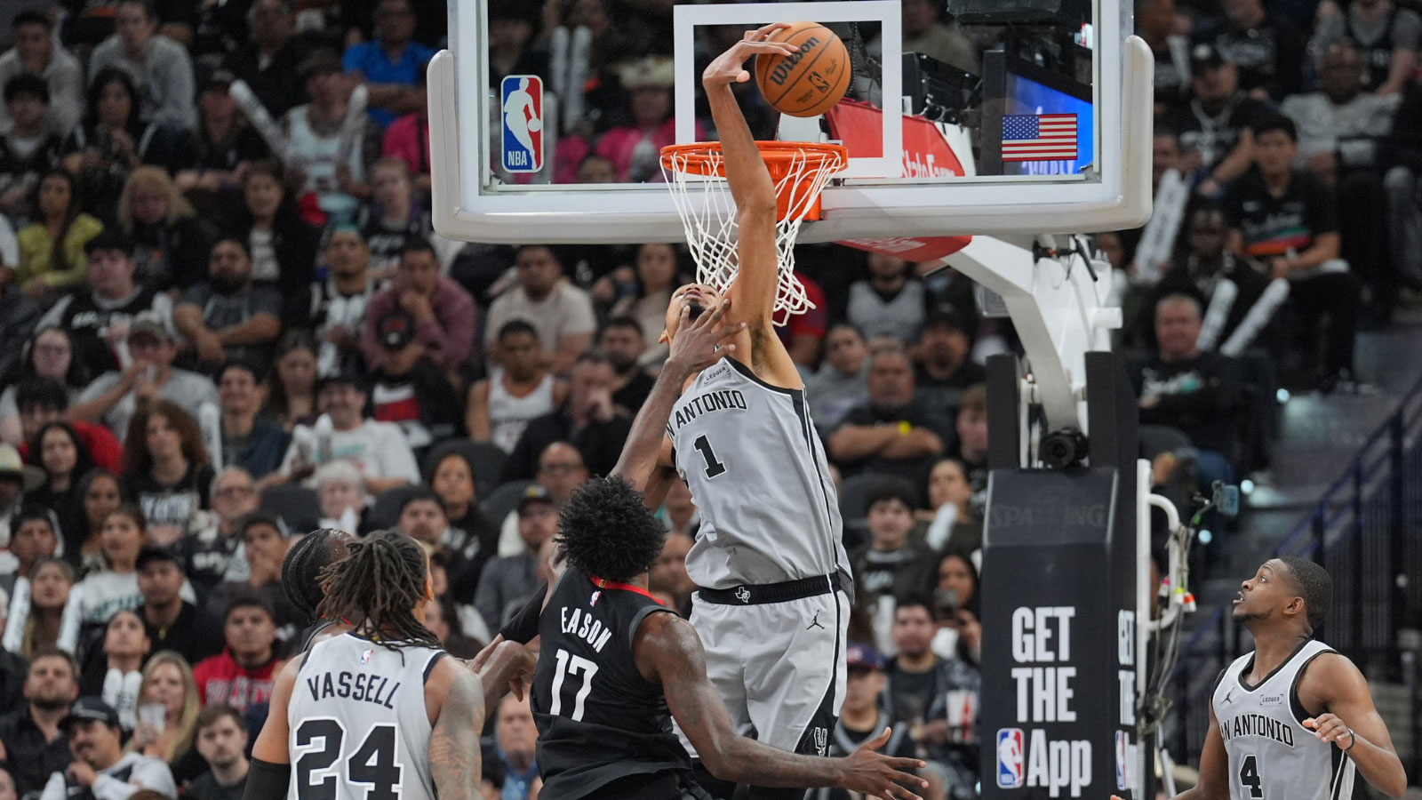 San Antonio Spurs forward Victor Wembanyama (1) blocks a shot by Houston Rockets forward Tari Eason (17) in the second half at Frost Bank Center.