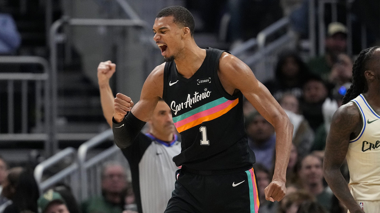 San Antonio Spurs forward Victor Wembanyama (1) celebrates after scoring a basket during the fourth quarter against the Milwaukee Bucks at Fiserv Forum. 