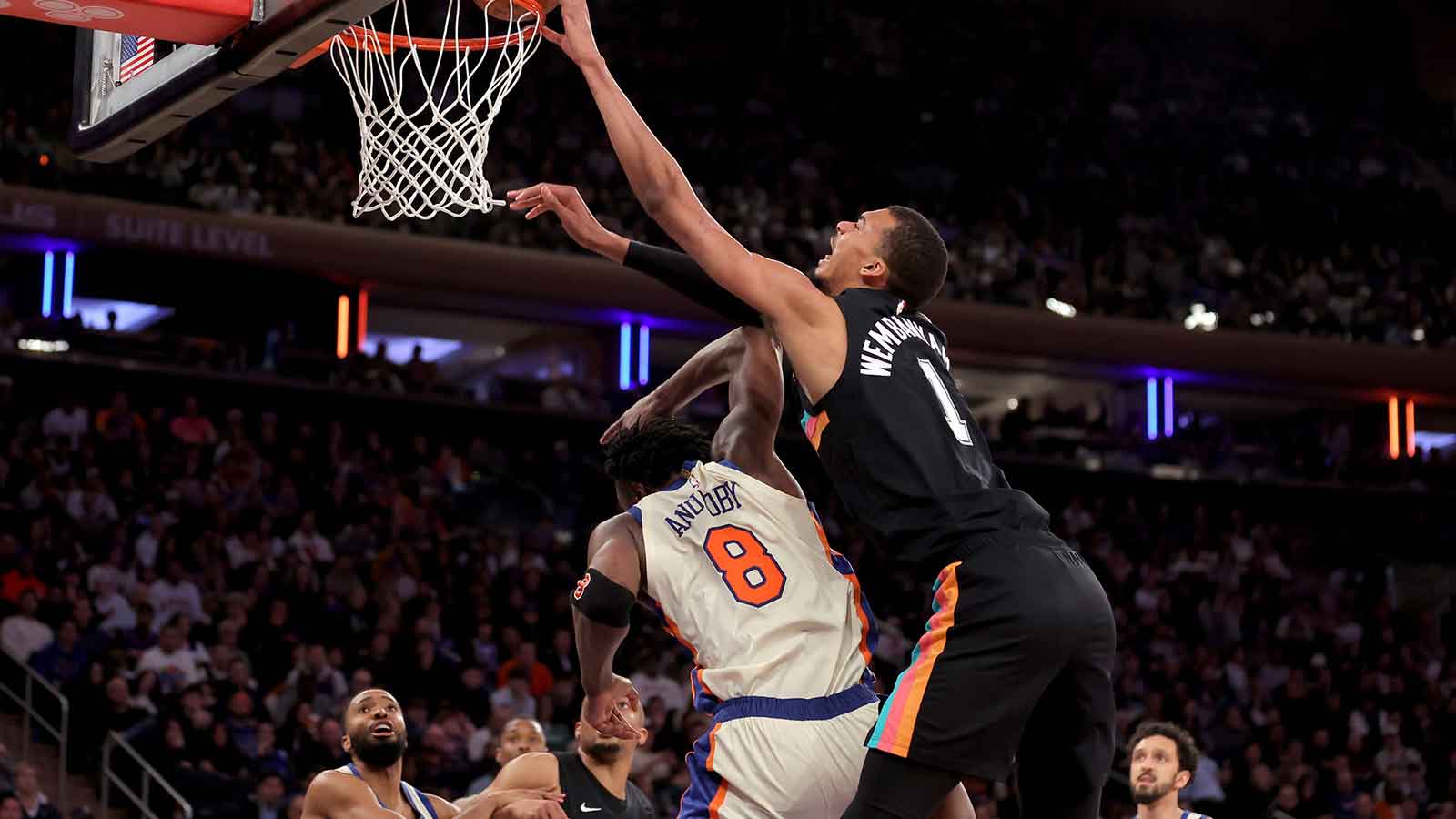 San Antonio Spurs forward Victor Wembanyama (1) dunks over New York Knicks forward OG Anunoby (8) during the third quarter at Madison Square Garden.