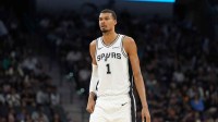 San Antonio Spurs forward Victor Wembanyama (1) looks up the court in the second half against the Charlotte Hornets at Frost Bank Center.