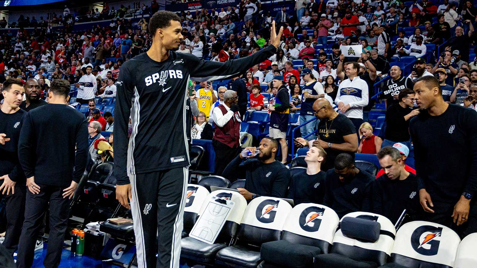 San Antonio Spurs forward/center Victor Wembanyama (1) waves to fans against the New Orleans Pelicans during the first half at Smoothie King Center. 