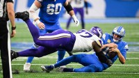 Detroit Lions quarterback Jared Goff (16) is brought down by Minnesota Vikings defensive lineman Javon Hargrave (97) in the third quarter at Ford Field.