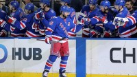 New York Rangers center Vincent Trocheck (16) celebrates his power play goal against the Los Angeles Kings with teammates during the third period at Madison Square Garden.