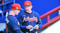 Atlanta Braves manager Walt Weiss (4) talks with bench coach Tony Mansolino (89) before the start of the game against the Pittsburgh Pirates during spring training at CoolToday Park.