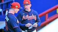 Atlanta Braves manager Walt Weiss (4) talks with bench coach Tony Mansolino (89) before the start of the game against the Pittsburgh Pirates during spring training at CoolToday Park