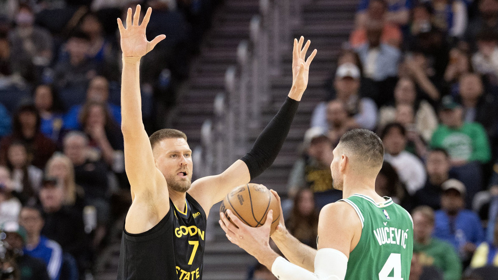 Warriors center Kristaps Porzingis (7) guards Boston Celtics center Nikola Vucevic (4) during the third quarter at Chase Center