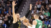 Warriors center Kristaps Porzingis (7) guards Boston Celtics center Nikola Vucevic (4) during the third quarter at Chase Center