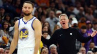 Warriors guard Stephen Curry (30) reacts alongside head coach Steve Kerr