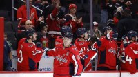 Washington Capitals defenseman John Carlson (74) celebrates with teammates after scoring a goal against the New York Rangers during the second period at Capital One Arena.