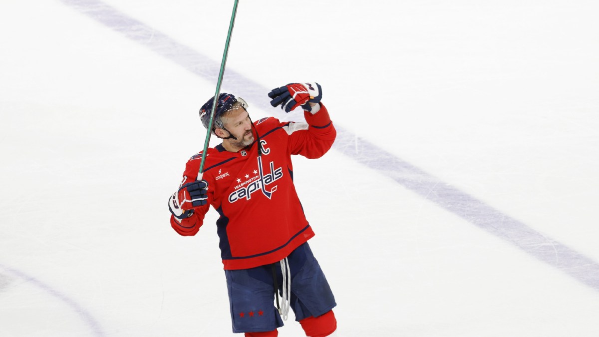 washington Capitals left wing Alex Ovechkin (8) waves to his family in the stands after defeating the New Jersey Devils at Capital One Arena.
