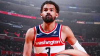 Trae Young in Wizards gear with serious face