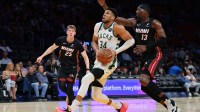 Milwaukee Bucks forward Giannis Antetokounmpo (34) drives to the basket against Miami Heat center Bam Adebayo (13) during the first quarter at loanDepot Park. Mandatory Credit: Sam Navarro-Imagn Images