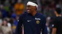 Denver Nuggets guard Peyton Watson (8) smiles before the game against the Portland Trail Blazers at Ball Arena.