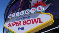 A Welcome to Las Vegas Super Bowl 58 sign at Allegiant Stadium.
