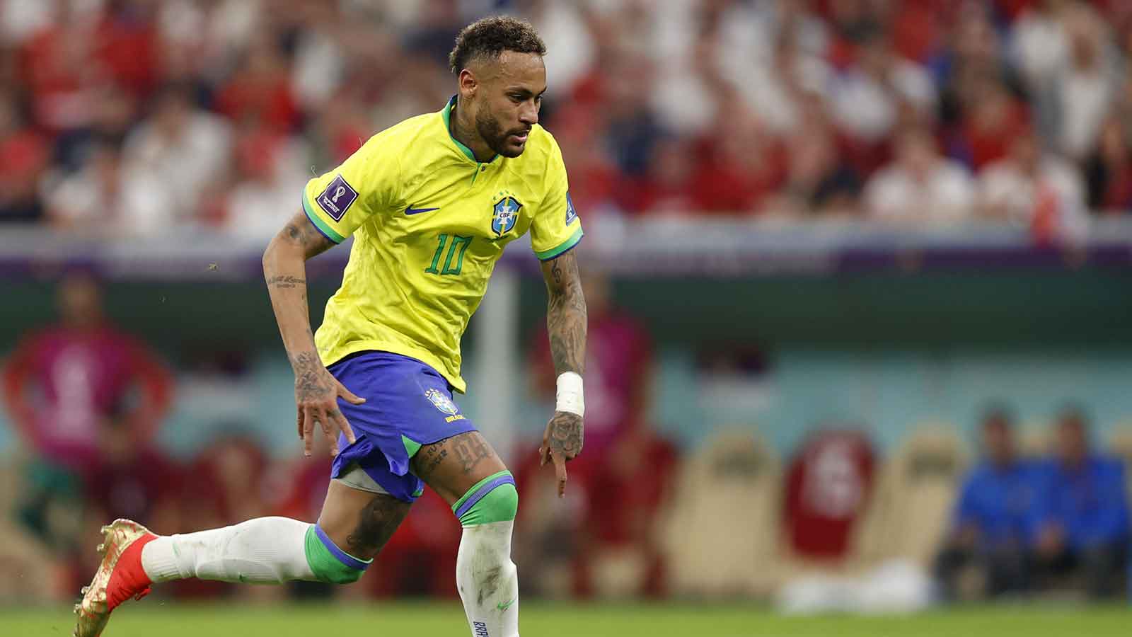 Brazil forward Neymar (10) kicks the ball against Serbia during the second half in a group stage match during the 2022 World Cup at Lusail Stadium.