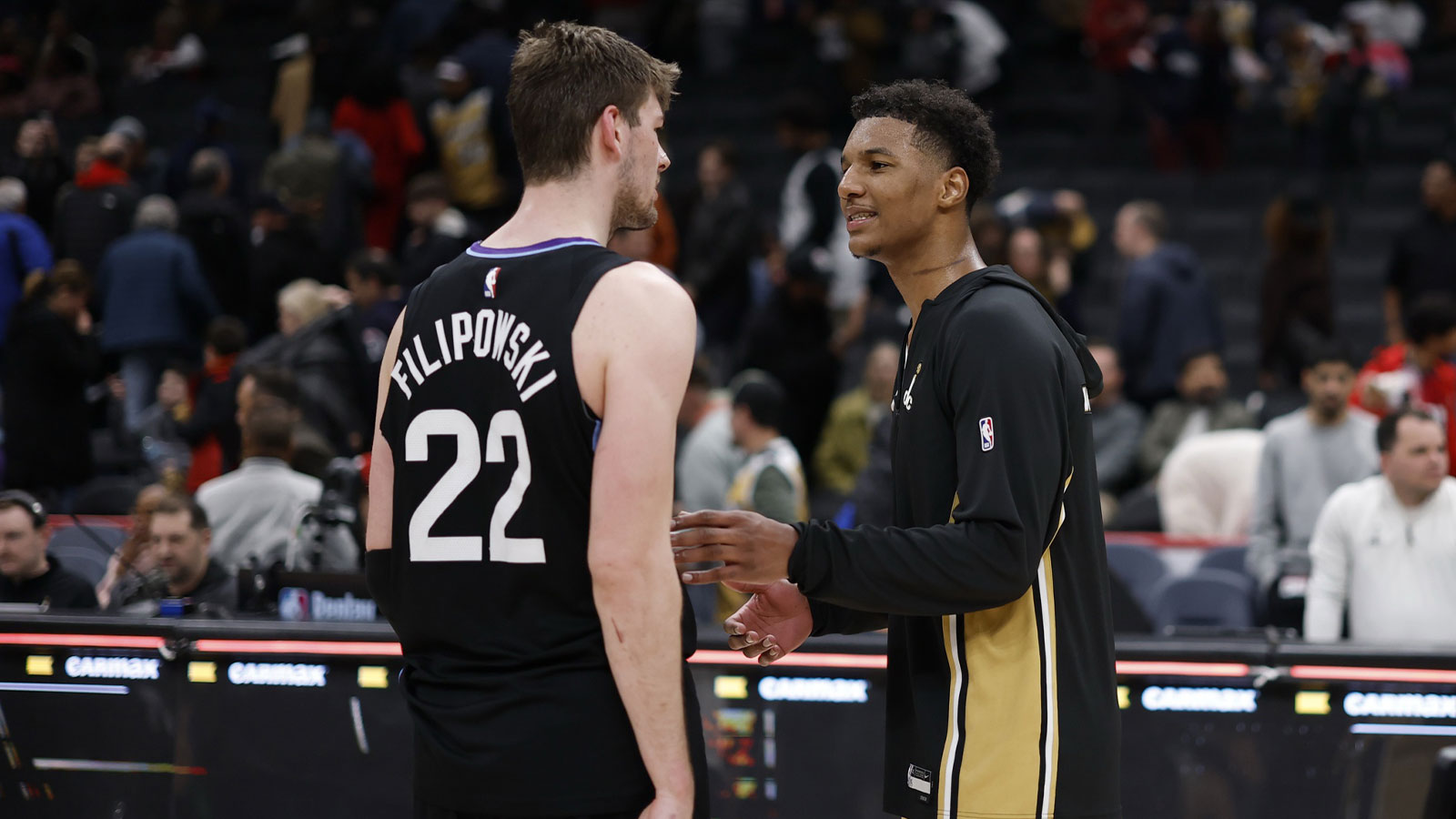 Utah Jazz forward Kyle Filipowski (22) talks with Washington Wizards forward Julian Reese (R) after their game at Capital One Arena.