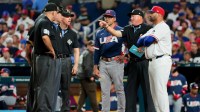 United States manager Mark DeRosa (9) and Dominican Republic manager Albert Pujols (5) meet prior to a semifinal game of the 2026 World Baseball Classic at loanDepot Park.