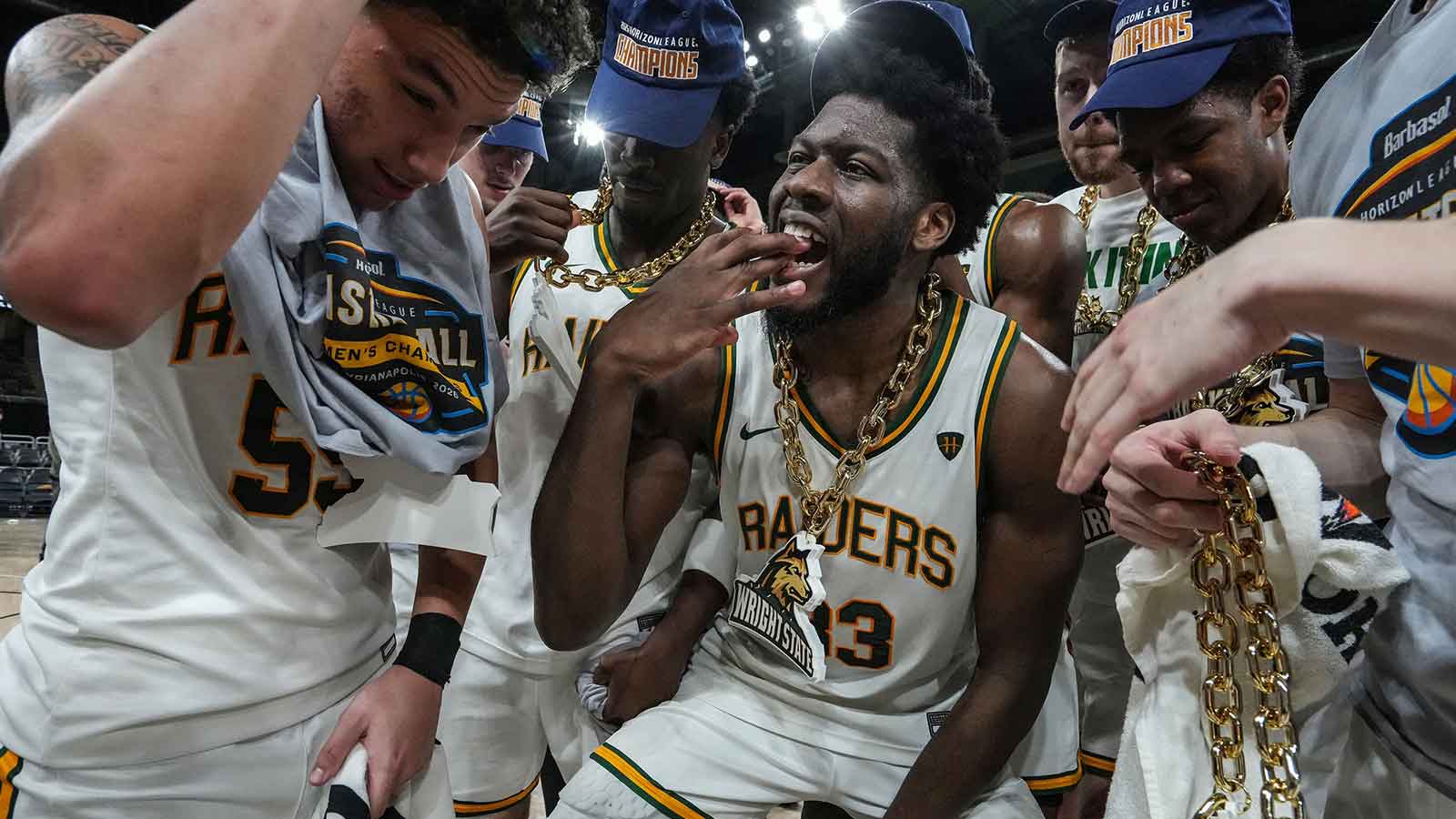 Wright State Raiders forward Michael Imariagbe (33) celebrates with teammates on Tuesday, March 10, 2026, at Corteva Coliseum at the Indiana State Fairgrounds in Indianapolis. The Wright State Raiders defeated the Detroit Mercy Titans, 66-63 to win the Horizon League Championship.