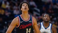 LA Clippers center Yanic Konan Niederhäuser (14) looks to rebound the shot against Golden State Warriors forward Jonathan Kuminga (1) during the fourth quarter at Chase Center.