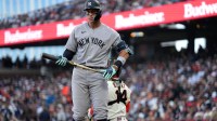 New York Yankees right fielder Aaron Judge (99) holds onto his bat after fouling off a pitch against the San Francisco Giants in the third inning at Oracle Park.
