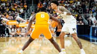 Michigan forward Yaxel Lendeborg (23) looks to pass against Tennessee forward Dewayne Brown II (6) during the second half of NCAA Tournament Elite 8 round at United Center in Chicago on Sunday, March 29, 2026.