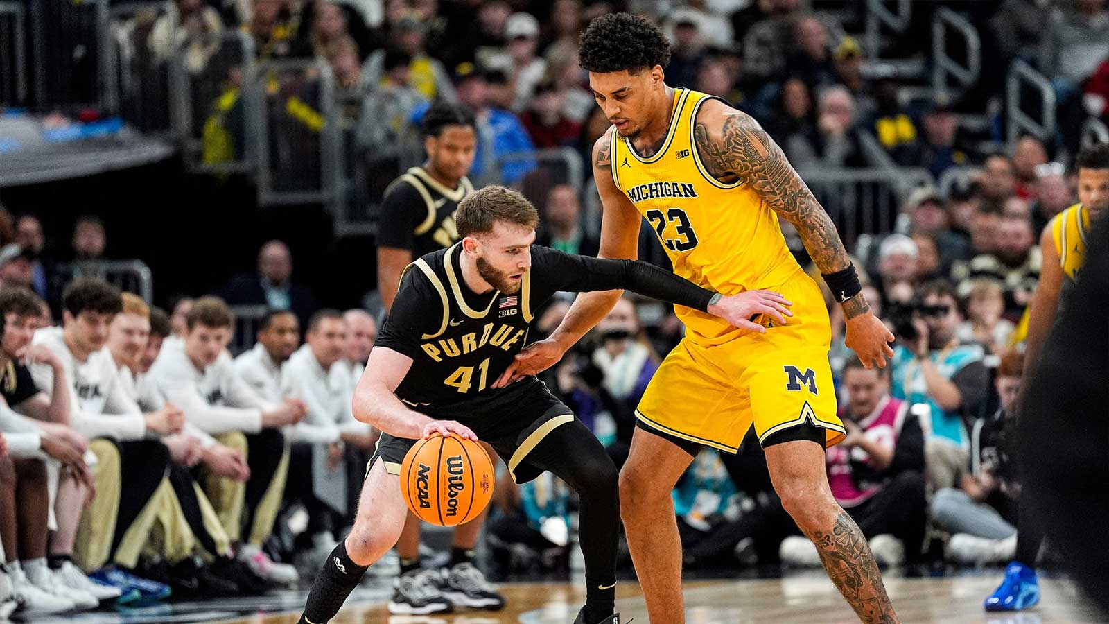 Michigan forward Yaxel Lendeborg (23) defends Purdue guard Braden Smith (41) during the second half of Big Ten Tournament final at United Center in Chicago on Sunday, March 15, 2026.