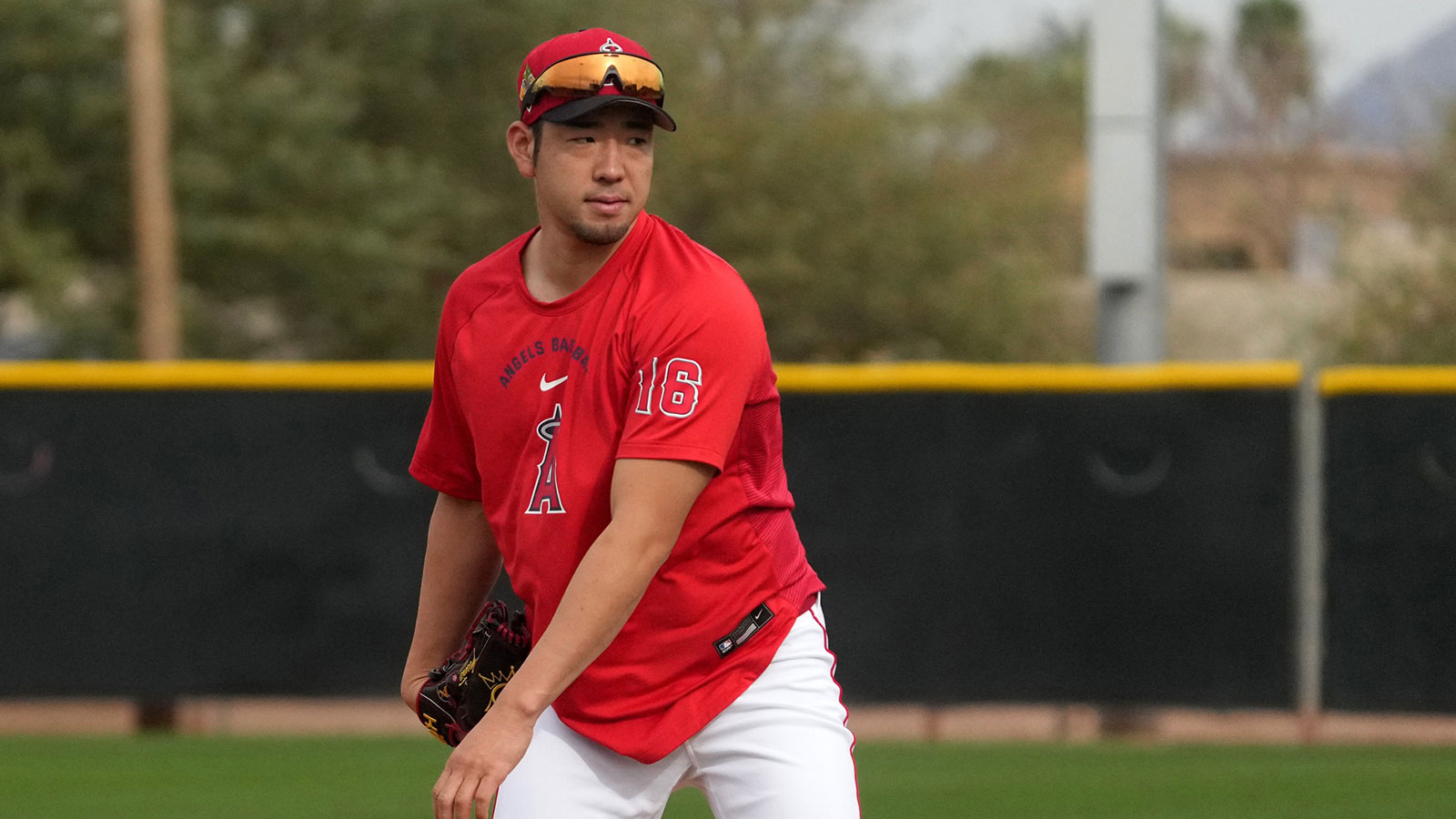 Los Angeles Angels pitcher Yusei Kikuchi (16) runs through drills during spring training camp. 