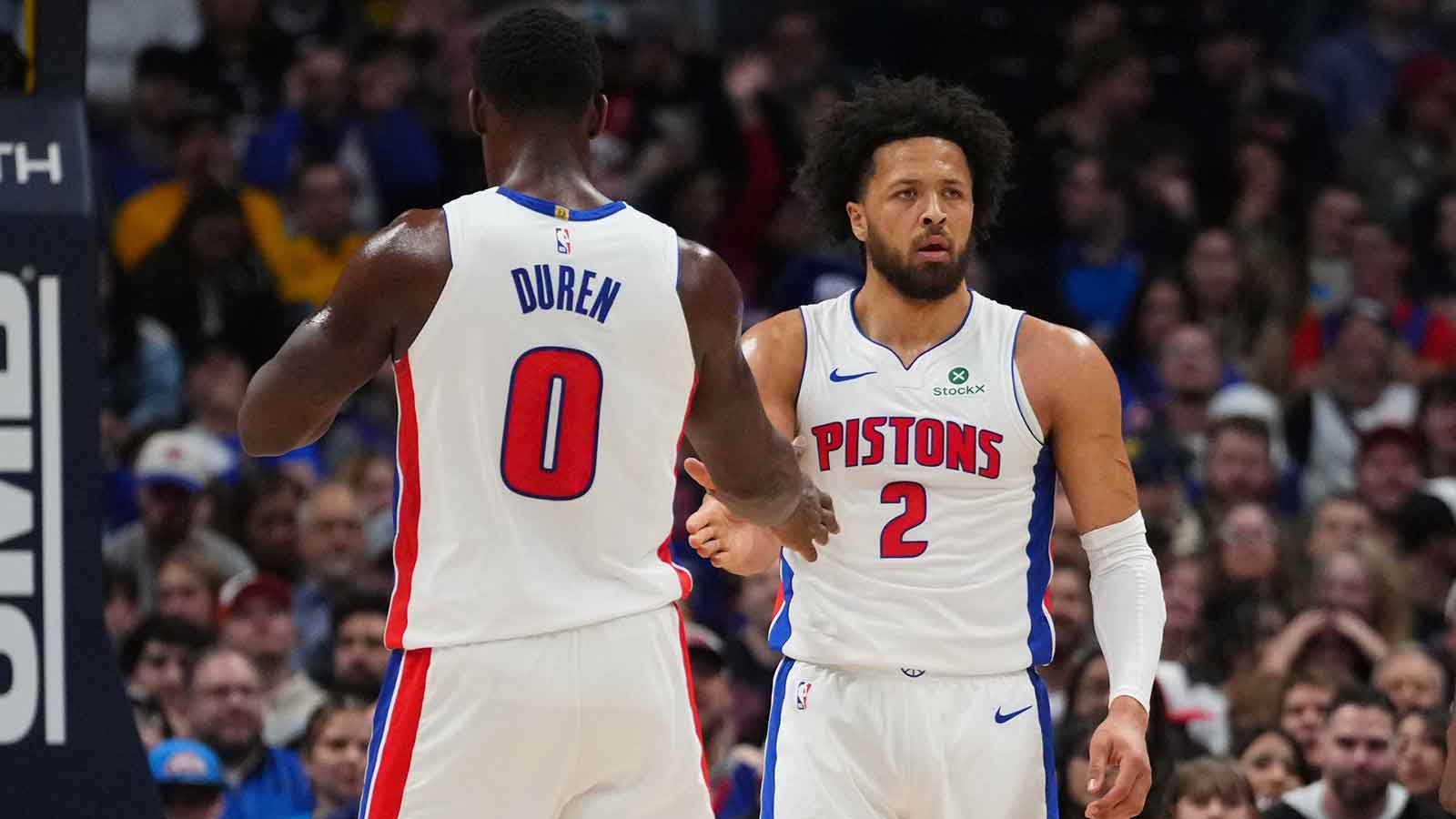 Detroit Pistons guard Cade Cunningham (2) and center Jalen Duren (0) react to a foul called in the first quarter against the Denver Nuggets at Ball Arena.