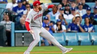 Cincinnati Reds pitcher Zack Littell (52) delivers a pitch in the first inning of the MLB National League Wild Card Game 2 between the Cincinnati Reds and LA Dodgers, Wednesday, Oct. 1, 2025, at Dodger Stadium in Los Angeles, California.