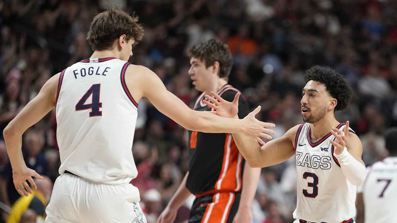 Gonzaga Bulldogs guard Braeden Smith (3) celebrates with guard Davis Fogle (4) against the Oregon State Beavers during the first half at Orleans Arena.