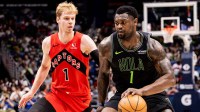 New Orleans Pelicans forward Zion Williamson (1) dribbles against Toronto Raptors guard/forward Gradey Dick (1) during the first half at Smoothie King Center.