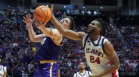 Northern Iowa Panthers forward Tristan Smith (14) and St. John's Red Storm forward Zuby Ejiofor (24) reach for a ball in the second half during a first round game of the men's 2026 NCAA Tournament at Viejas Arena.