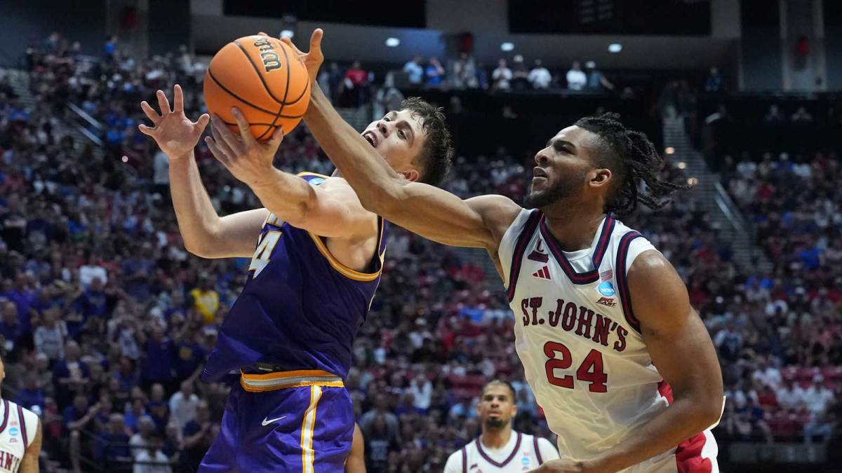 Northern Iowa Panthers forward Tristan Smith (14) and St. John's Red Storm forward Zuby Ejiofor (24) reach for a ball in the second half during a first round game of the men's 2026 NCAA Tournament at Viejas Arena.