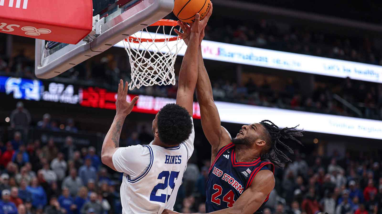 St. John's Red Storm forward Zuby Ejiofor (24) blocks a shot by Seton Hall Pirates center Najai Hines (25) during the second half at Prudential Center.