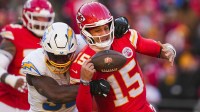 Los Angeles Chargers linebacker Odafe Oweh (98) sacks Kansas City Chiefs quarterback Patrick Mahomes (15) during the second half at GEHA Field at Arrowhead Stadium.