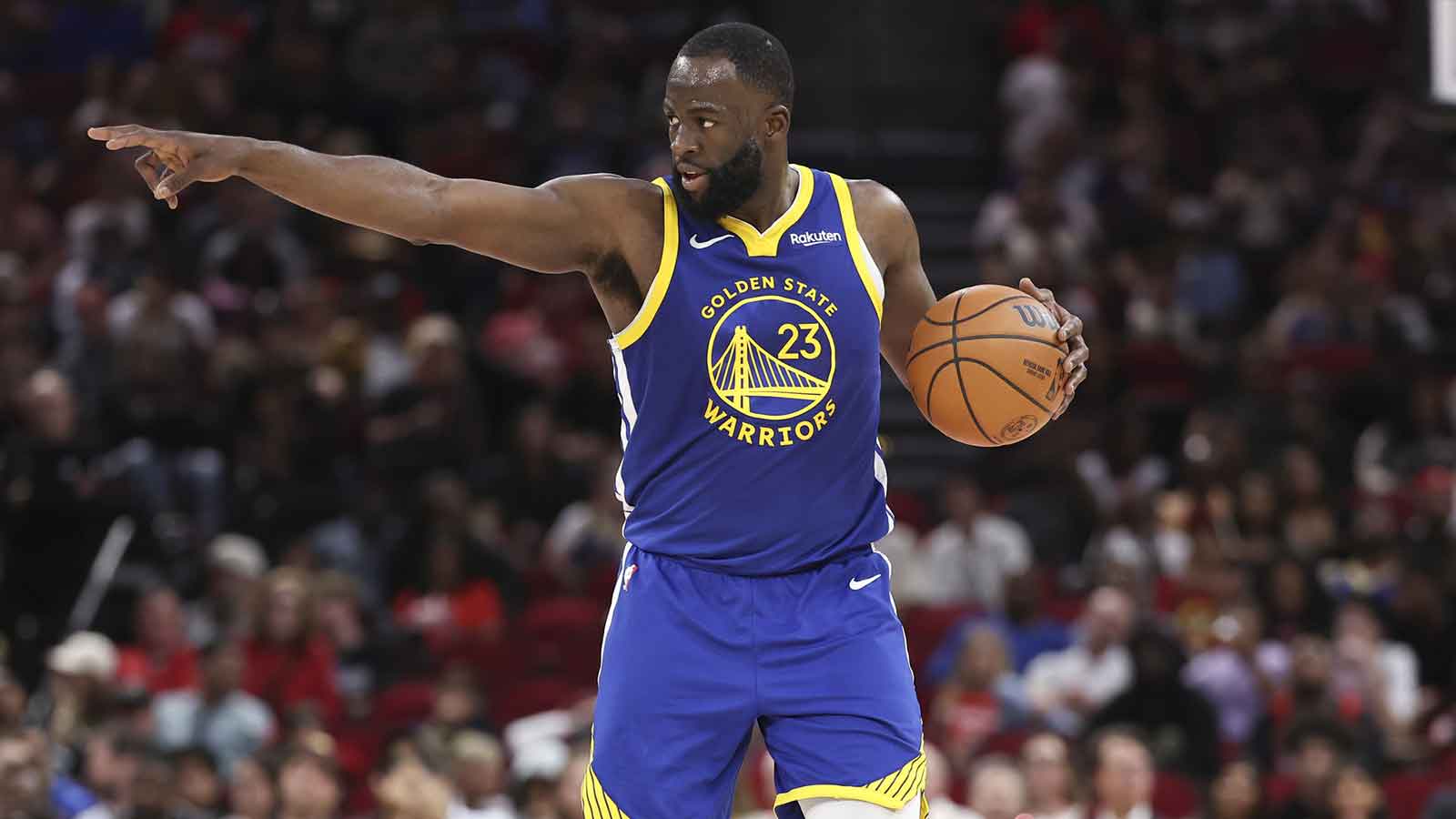 Golden State Warriors forward Draymond Green (23) brings the ball up the court during the second quarter against the Houston Rockets at Toyota Center.