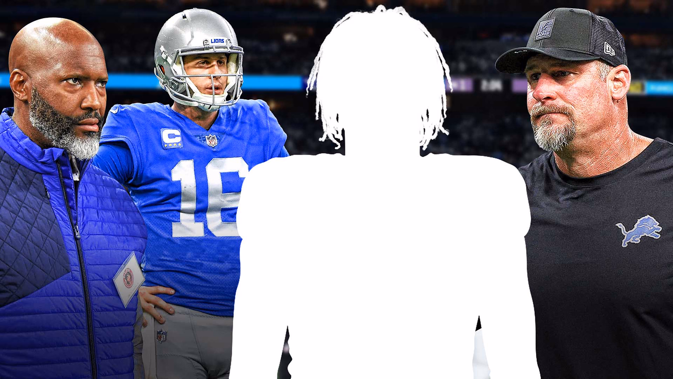 - One mystery player in the middle - Brad Holmes, Dan Campbell, Jared Goff around him - NFL Draft logo in the background