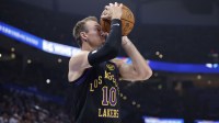 Los Angeles Lakers guard Luke Kennard (10) lines up a shot against the Oklahoma City Thunder during the first quarter at Paycom Center.