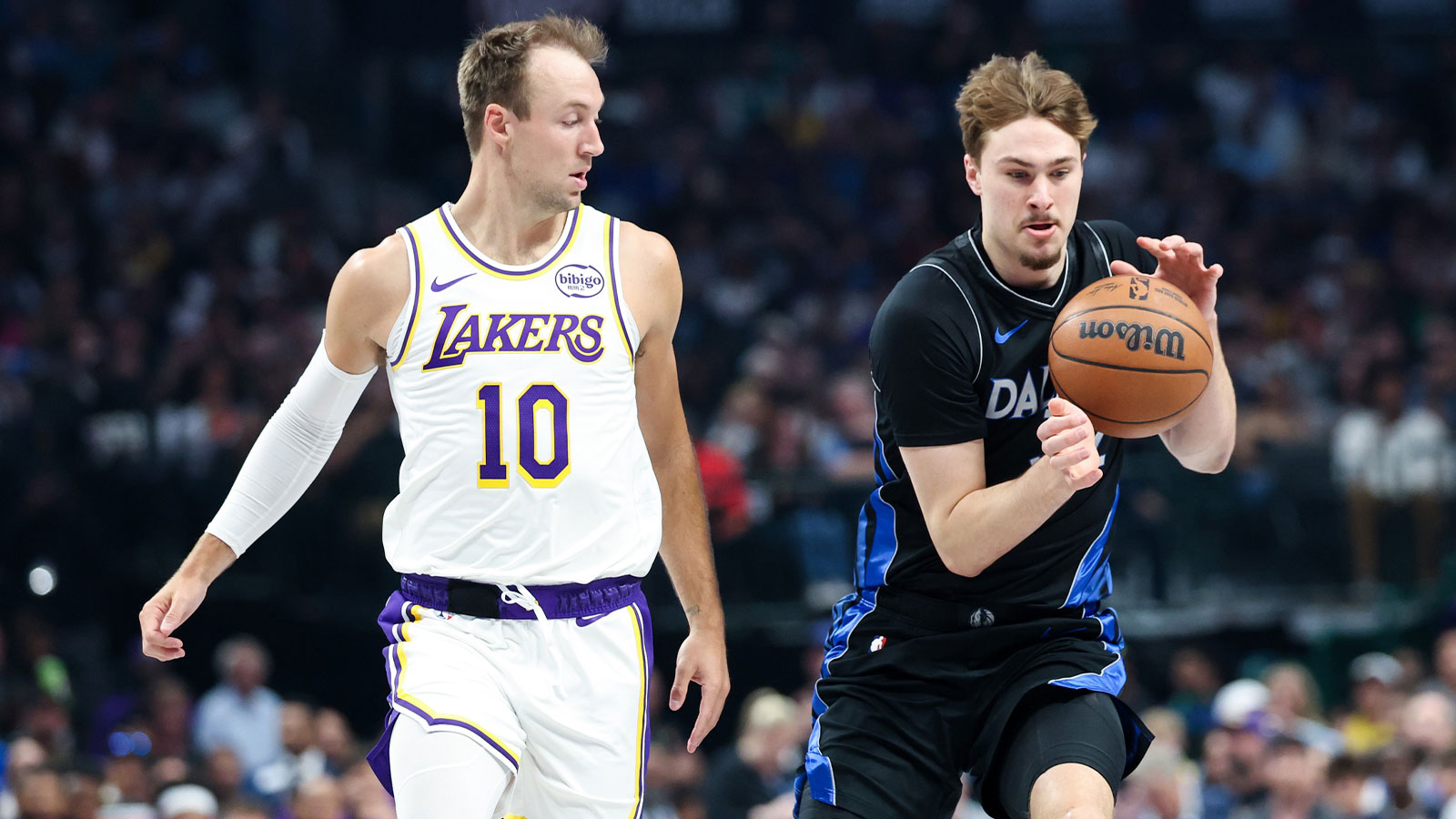Dallas Mavericks forward Cooper Flagg (32) controls the ball as Los Angeles Lakers guard Luke Kennard (10) defends during the first quarter at American Airlines Center.