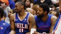 76ers forward Paul George (8) look on from the bench against the Washington Wizards in the second half at Capital One Arena with the injury logo in the background. Is Paul George playing tonight vs. Pistons Is Tyrese Maxey playing tonight vs. Pistons
