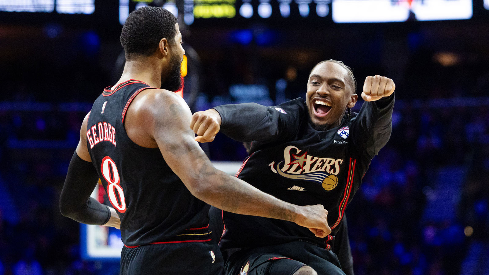 76ers forward Paul George (8) celebrates with guard Tyrese Maxey (0) after dunking the ball against the Brooklyn Nets during the second quarter at Xfinity Mobile Arena