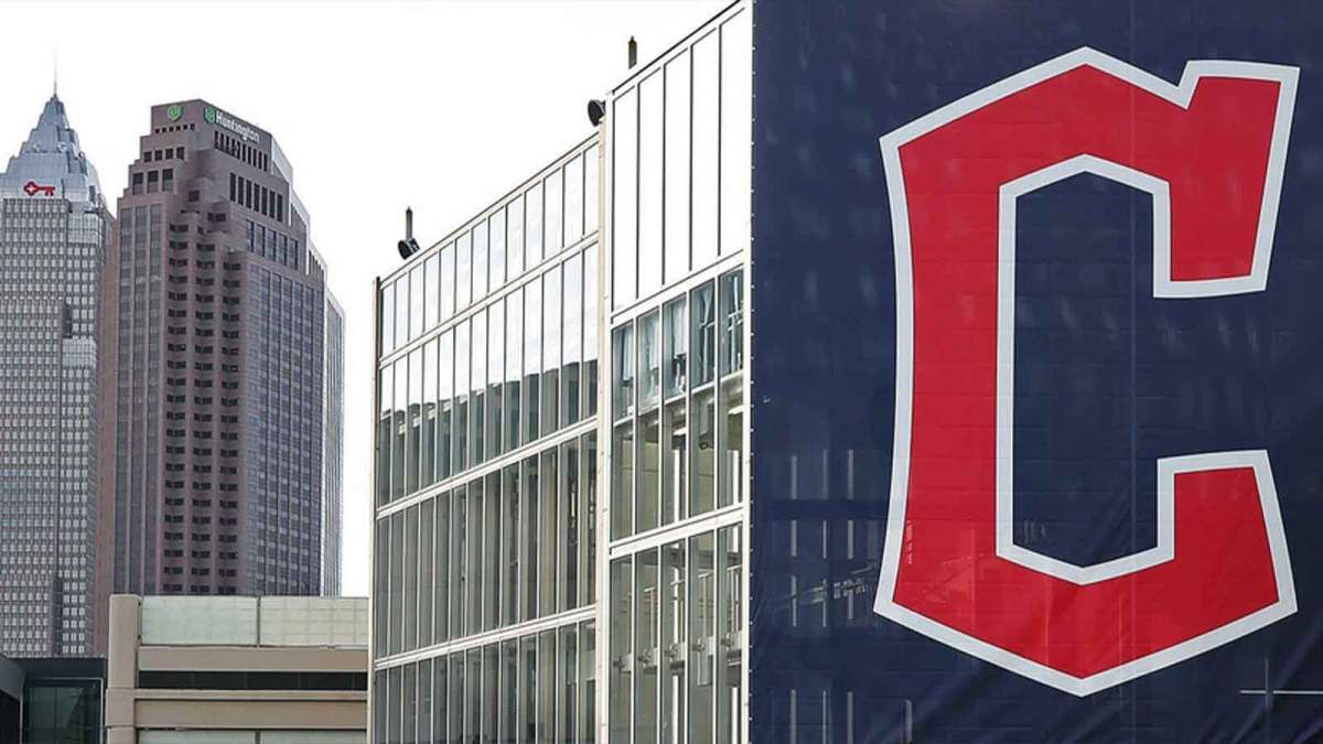 A banner with the Cleveland Guardians' new logo hangs from a parking deck before an MLB baseball game between the Cleveland Guardians and the San Francisco Giants at Progressive Field.