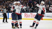 Washington Capitals left wing Alex Ovechkin (8) celebrates scoring a goal against the Utah Mammoth with center Dylan Strome (17) and left wing Aliaksei Protas (21) during the second period at Delta Center.