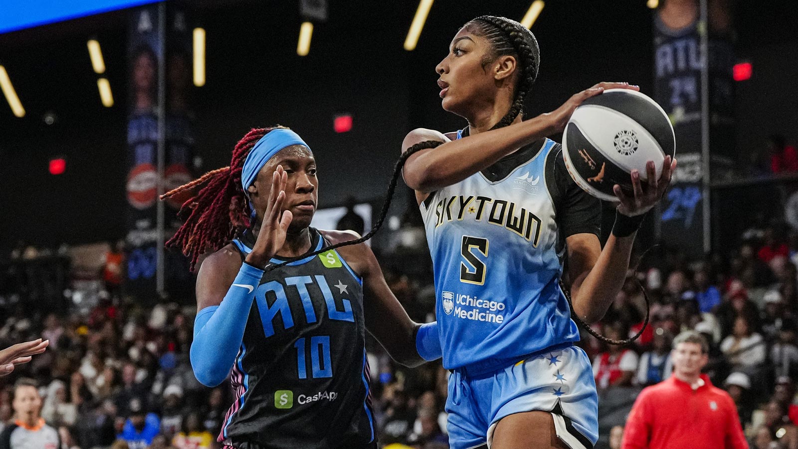 Chicago Sky forward Angel Reese (5) tries to pass defended by Atlanta Dream guard Rhyne Howard (10) during the first half at Gateway Center Arena at College Park. 