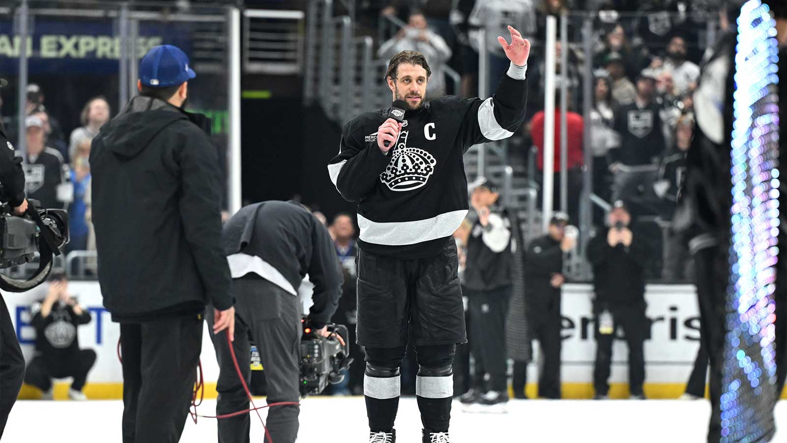 Los Angeles Kings center Anze Kopitar (11) speaks to the fans after a win against Edmonton Oilers at Crypto.com Arena.