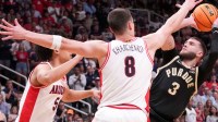 Purdue Boilermakers guard Braden Smith (3) looks to pass while being defended by Arizona Wildcats guard Brayden Burries (5) and forward Ivan Kharchenkov (8) during a NCAA Tournament game Saturday, March 28, 2026 at SAP Center in San Jose, Calif. Purdue fell to Arizona 79-64.